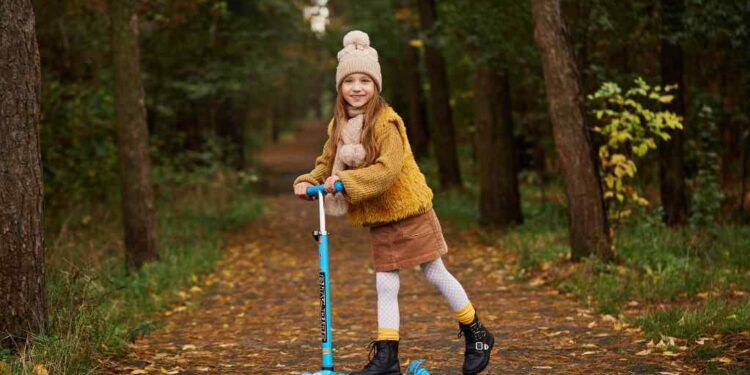 kid on the scooter image