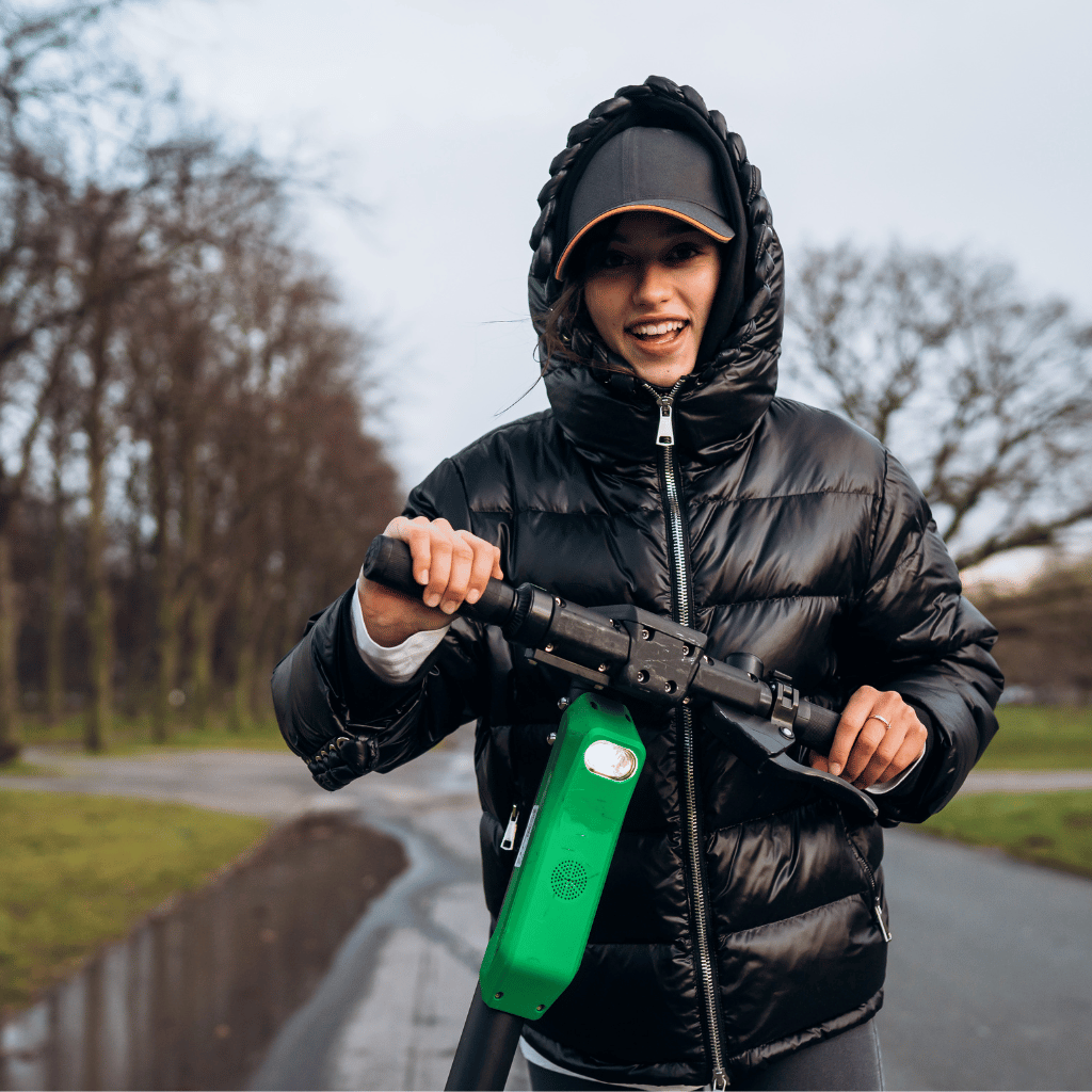 riding scooter in the rain image