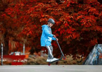 kid on the scooter image