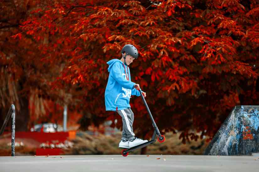 kid on the scooter image